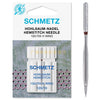 A white sewing needle labeled SCHMETZ HOHLSAUM HEMSTITCH NEEDLE 130/705 H WING shown against a green background.