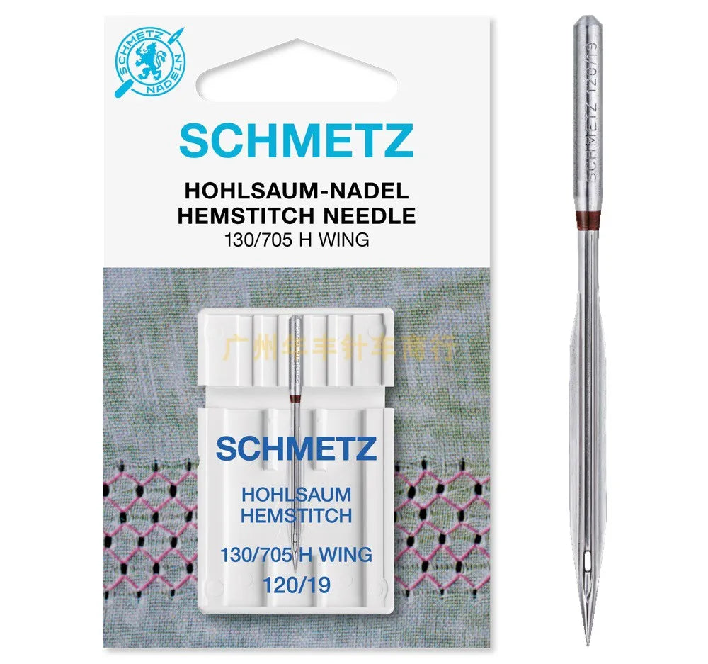 A white sewing needle labeled SCHMETZ HOHLSAUM HEMSTITCH NEEDLE 130/705 H WING shown against a green background.