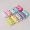 A collection of ten rolls of brightly colored polyester sewing thread in various shades of pink, blue, green, and yellow.