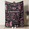 A black blanket featuring pink and white retro punk style skulls, guns, and text like Suicideboys and grep 59.