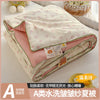 A washable quilt with a cartoon pattern, featuring pink and cream colors.
