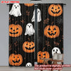 Black curtain panels featuring orange Halloween pumpkin and white ghost designs.
