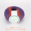 A ball of multi-colored wool yarn featuring shades of purple, pink, and red, labeled QJH Australiau waal.