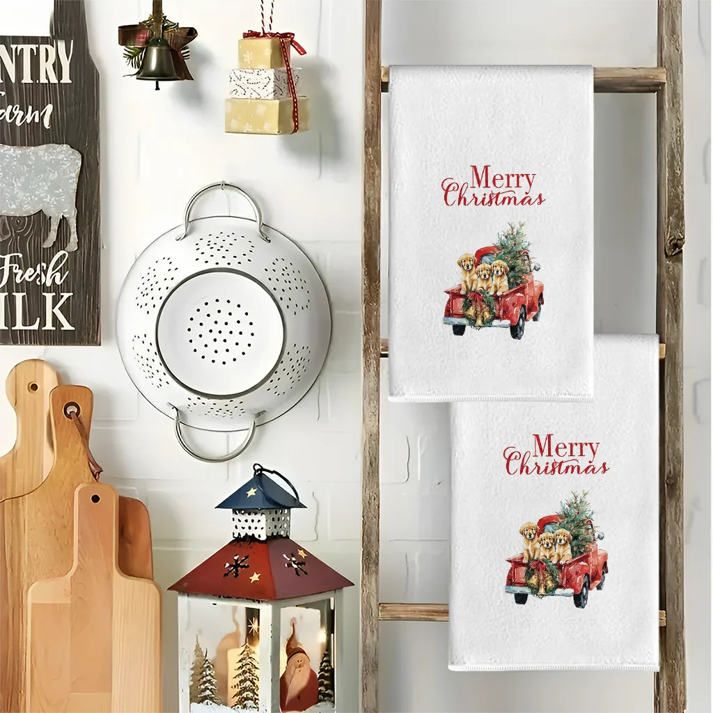 A set of three Christmas themed kitchen towels featuring a dog and truck design