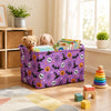A purple foldable storage basket filled with stuffed animals and Halloween decorations sits on a wooden floor.