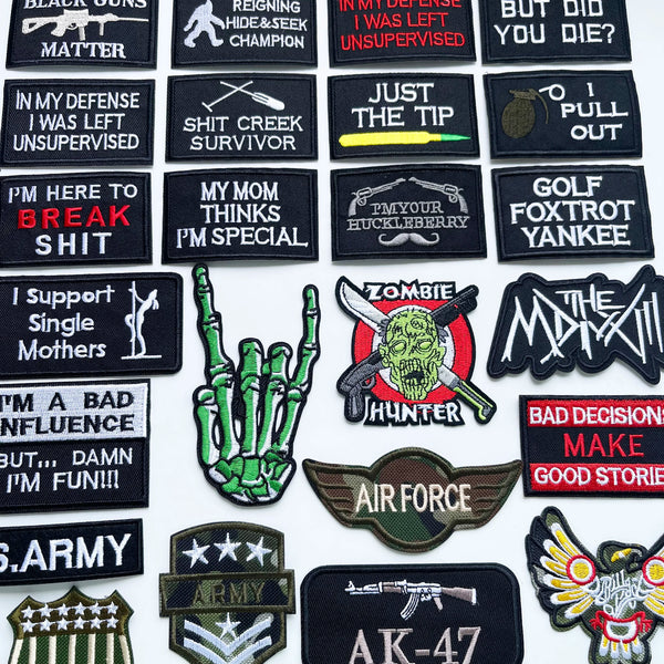 A collection of black iron-on slogan patches featuring various humorous and edgy phrases related to survival, military, and g