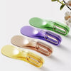 A collection of five colored mattress lifter wedges in shades of green, purple, beige, and yellow.