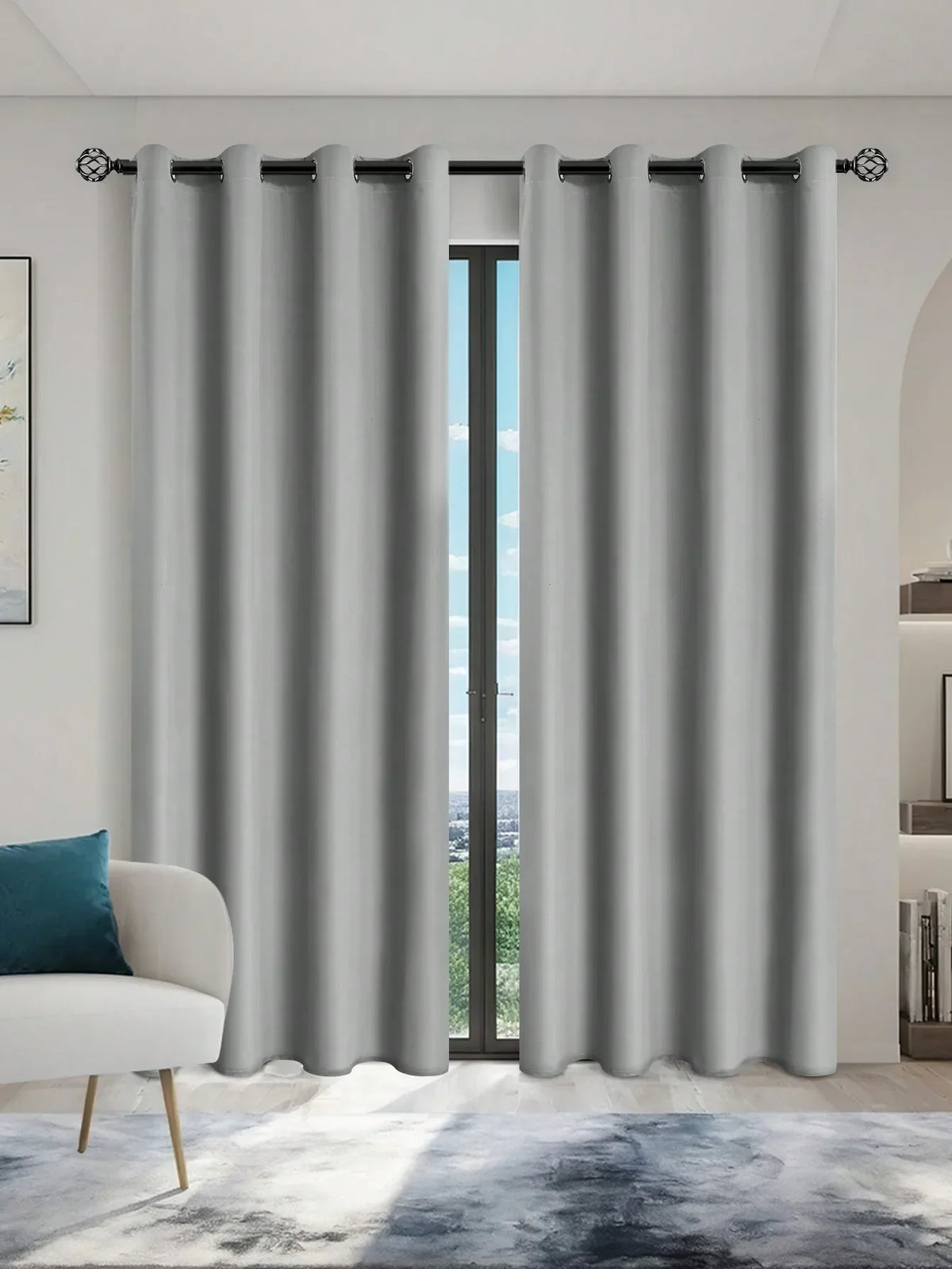 Gray blackout window curtains hanging in a doorway with black grommets.