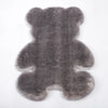 A gray plush bear-shaped non-slip area rug.
