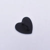 A small, black metal heart-shaped phone charm connector.