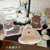 A collection of cute cartoon dog-themed hanging hand towels and decorative items.