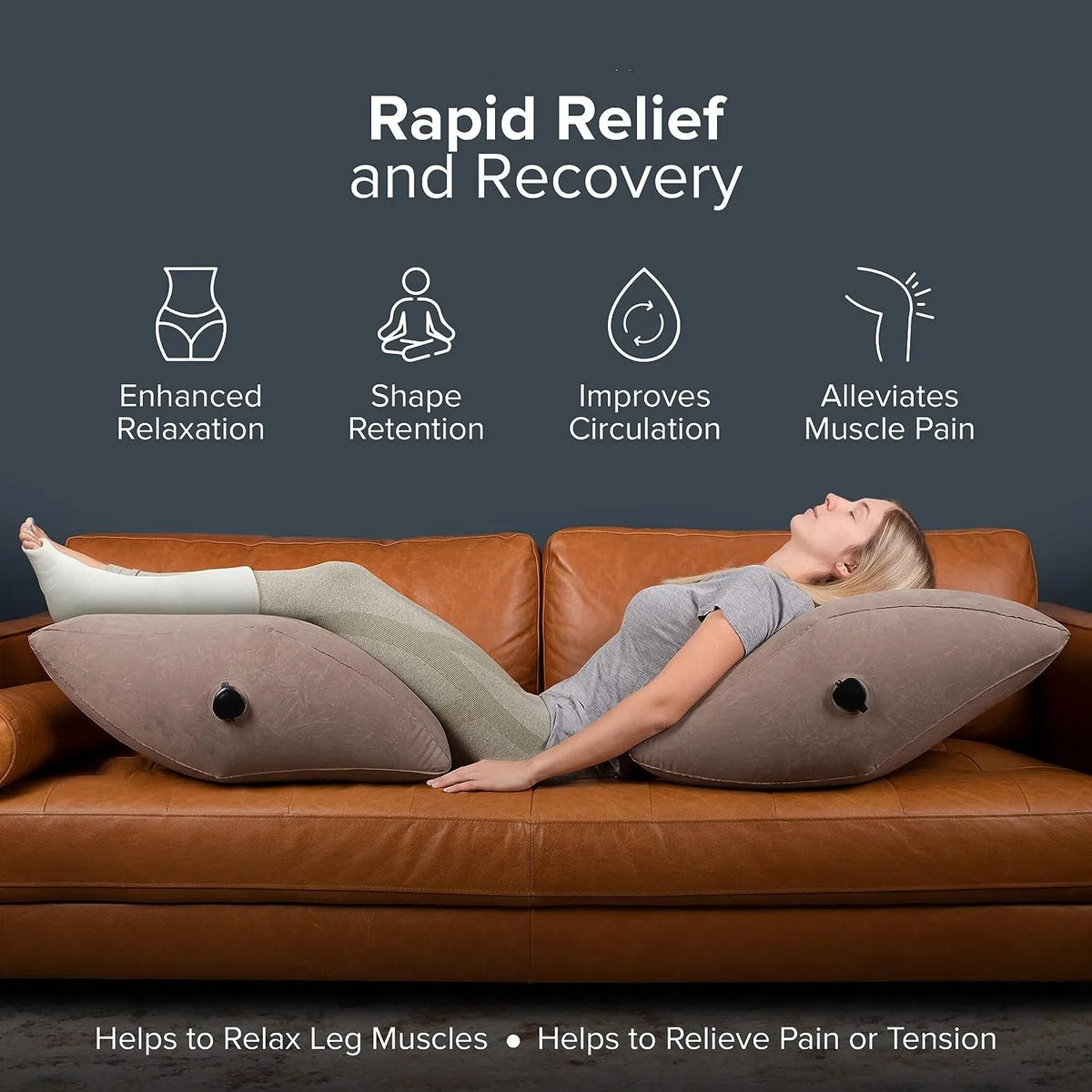 A woman is relaxing on a brown leather sofa using an inflatable leg elevation pillow for muscle relief.