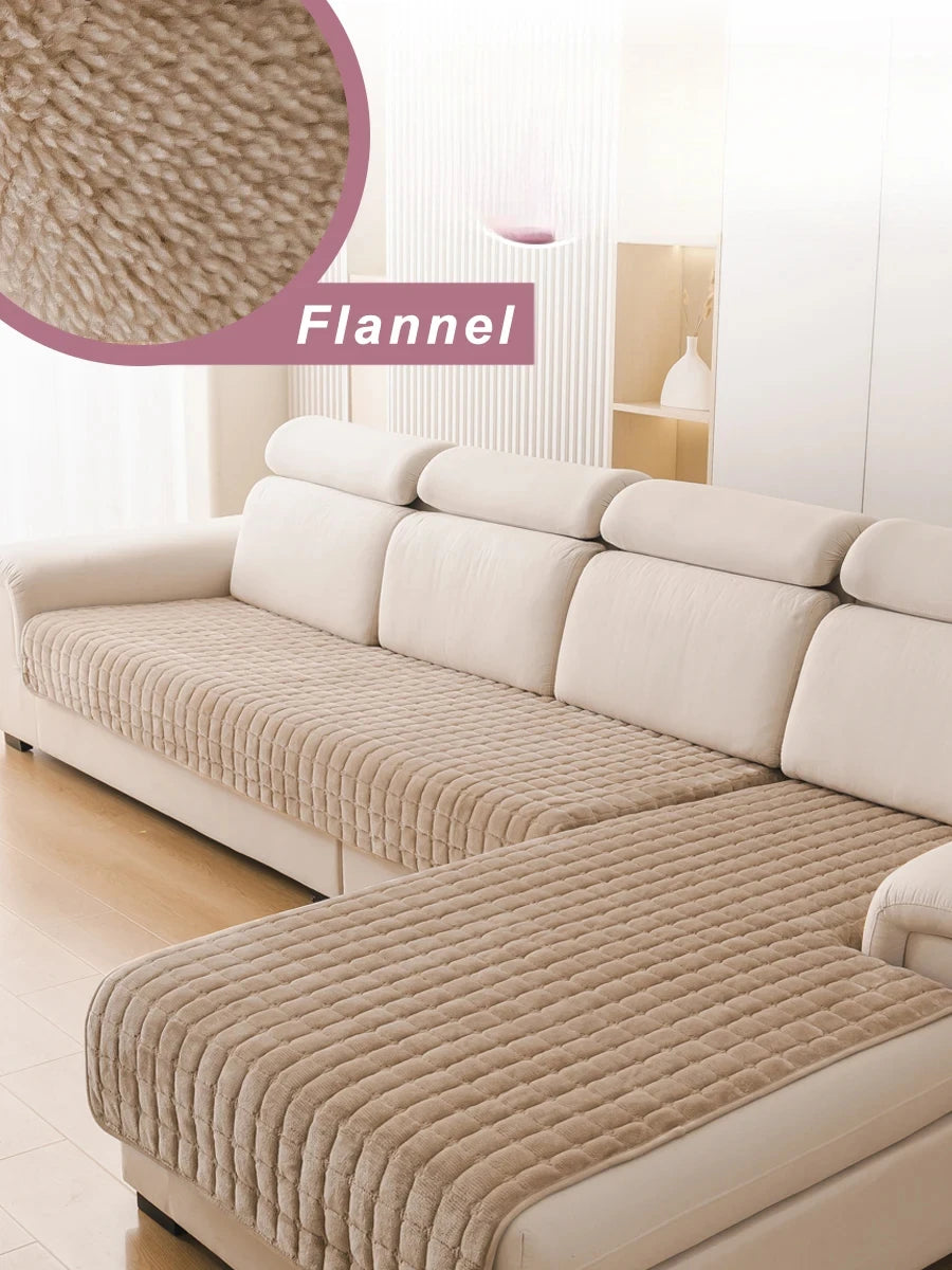 A beige flannel sofa cover on an L-shaped sectional sofa in a bright room.