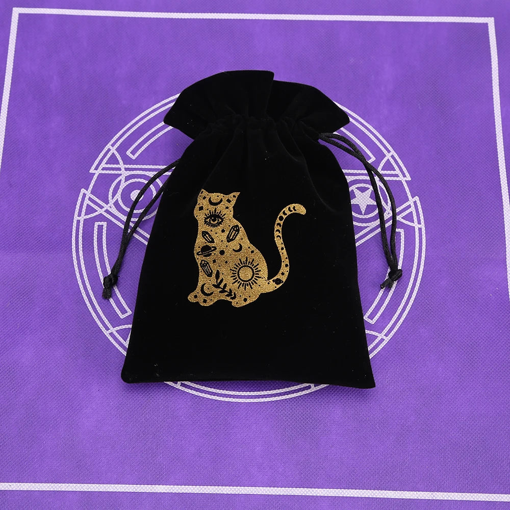 A black velvet pouch with a gold-colored silhouette of a cat on the front, set against a purple background.
