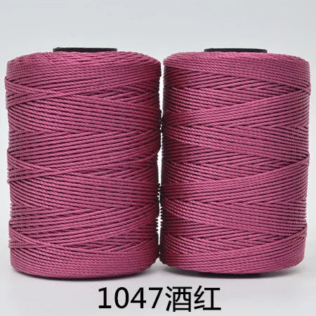 Spool of pink hand knitting and crochet cord for crafting