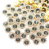 A close-up of sunflower crystal rhinestone sew-on buttons in gold and clear tones.