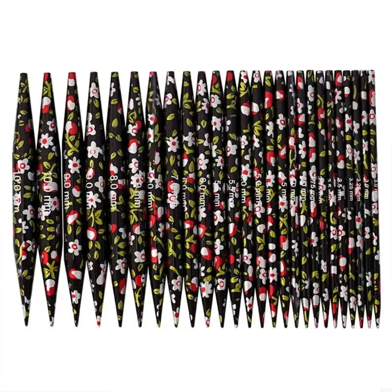 A set of interchangeable round knitting needles in black and white floral patterns.