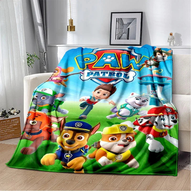 A colorful Paw Patrol cartoon themed flannel throw blanket featuring various animated dog characters.