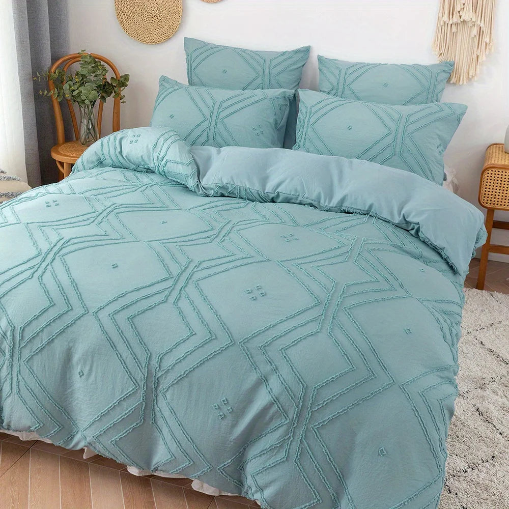 Light blue bohemian grid tufted duvet cover set with matching pillows on a bed.
