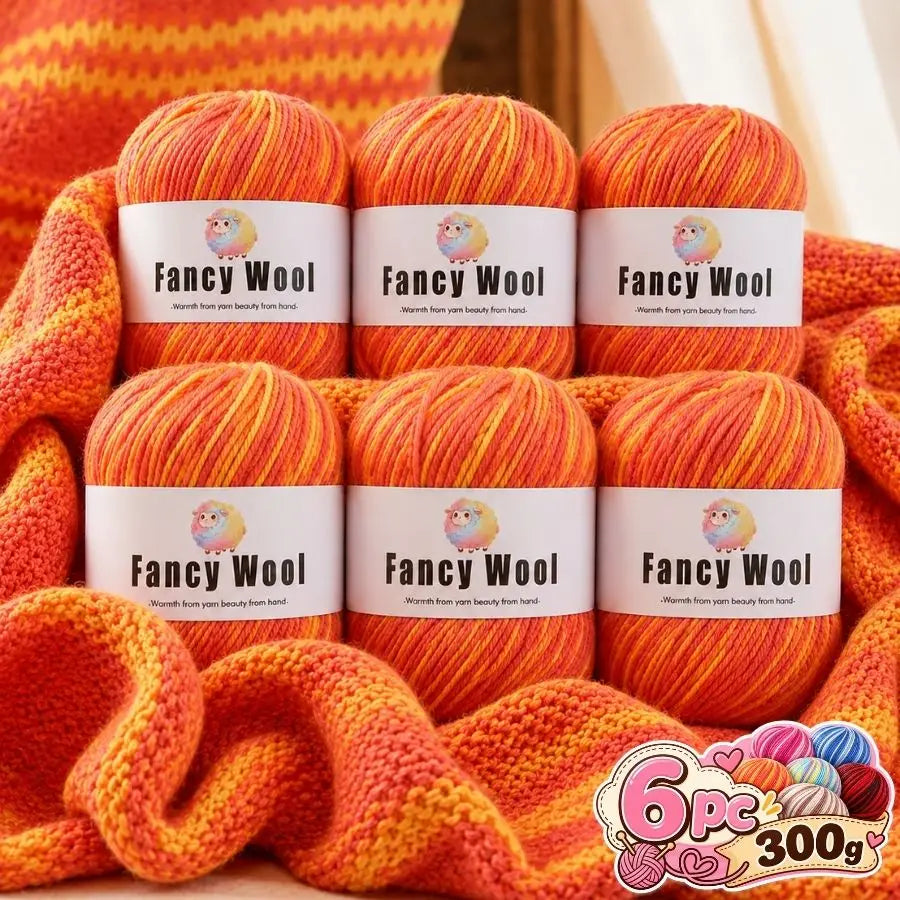 A set of six balls of orange and yellow gradient alpaca wool yarn for knitting and crochet projects.
