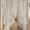 White French Rococo vintage lace curtains hanging in a doorway
