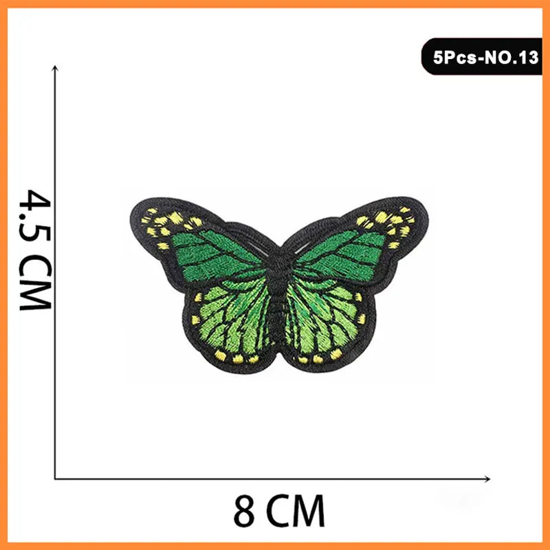 Set of five embroidered butterfly and rose iron-on patches, green with yellow accents.