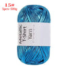 A spool of bright blue metallic T-shirt yarn for crochet and DIY crafts.