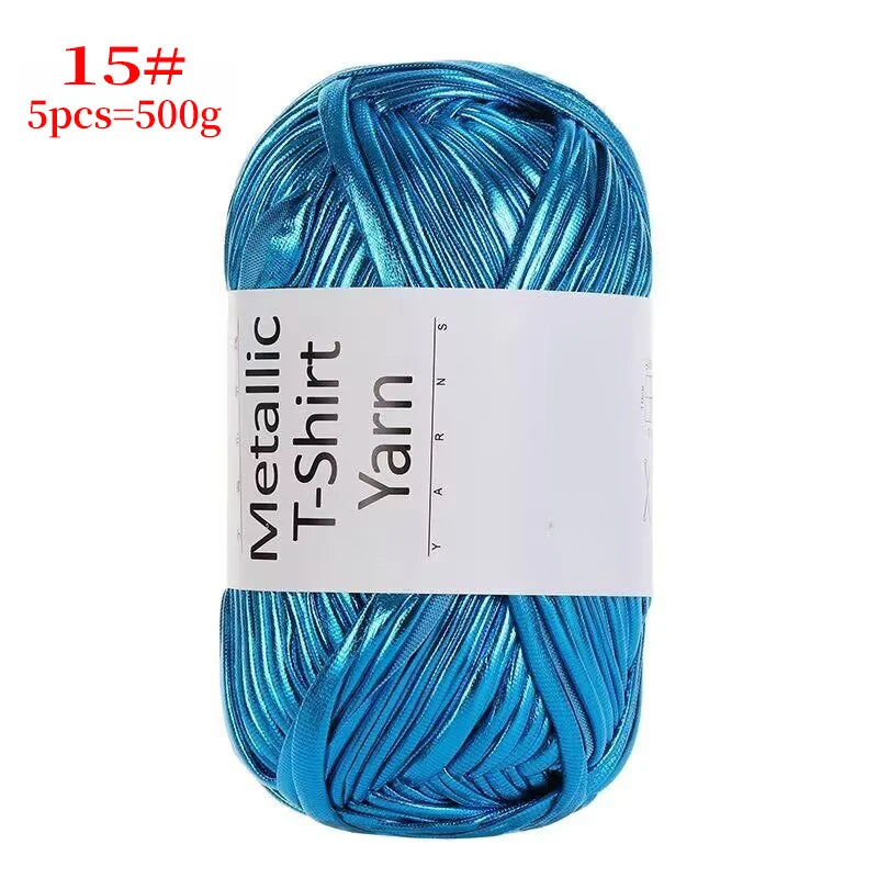 A spool of bright blue metallic T-shirt yarn for crochet and DIY crafts.