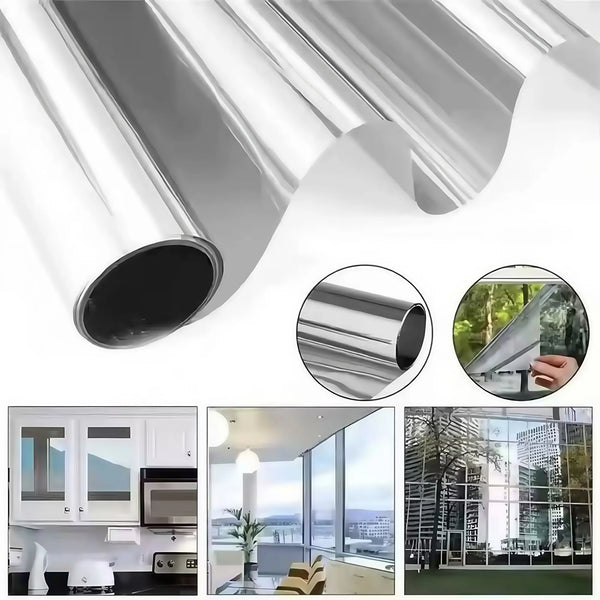 Close-up view of a silver window film roll being applied to glass for privacy and heat control.