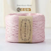 A spool of pink bamboo fiber yarn labeled as 02 Bamboo fiber for crafting.