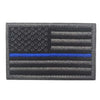 A rectangular flag patch featuring the design of the American flag and horizontal stripes in gray and blue.
