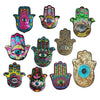 A collection of ten colorful handprint designs featuring various eye motifs and textures made with sequins.