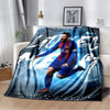 A dark blue and red graphic blanket featuring a soccer player in action on a light blue background.