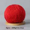 A ball of bright red mohair yarn used for crafting.