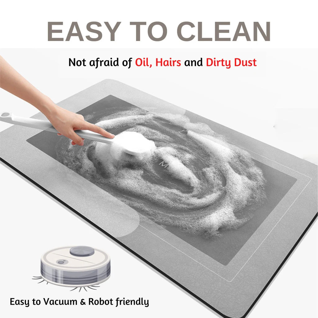 A hand is using a cleaning tool on a gray non-slip floor mat, demonstrating its easy to clean feature.