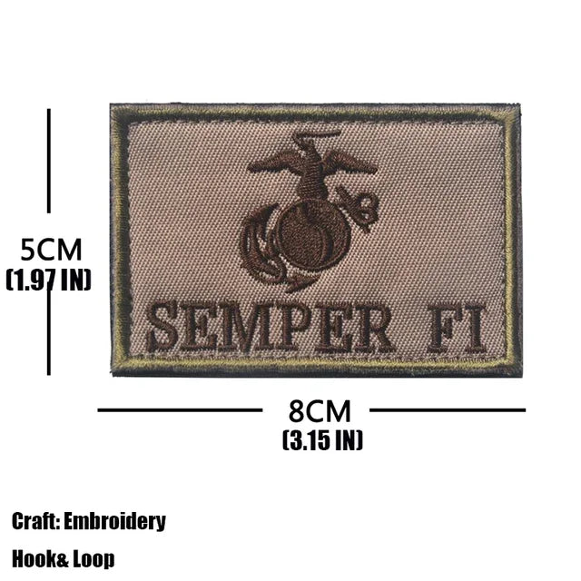 A rectangular embroidered patch featuring an eagle and the text SEMPER FI on a tan background.