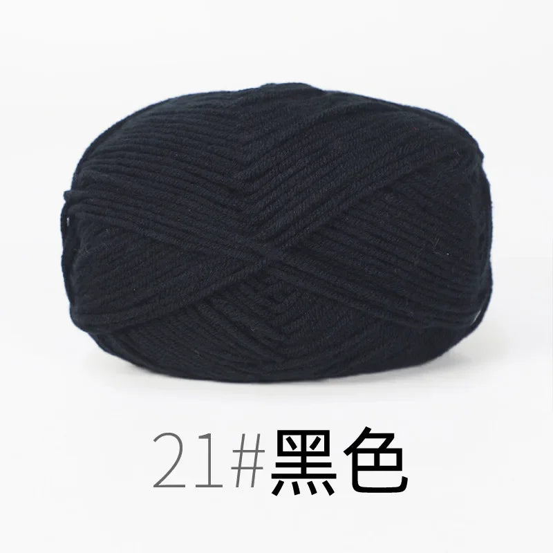 A ball of black organic cotton 4ply knitting yarn for crafts.