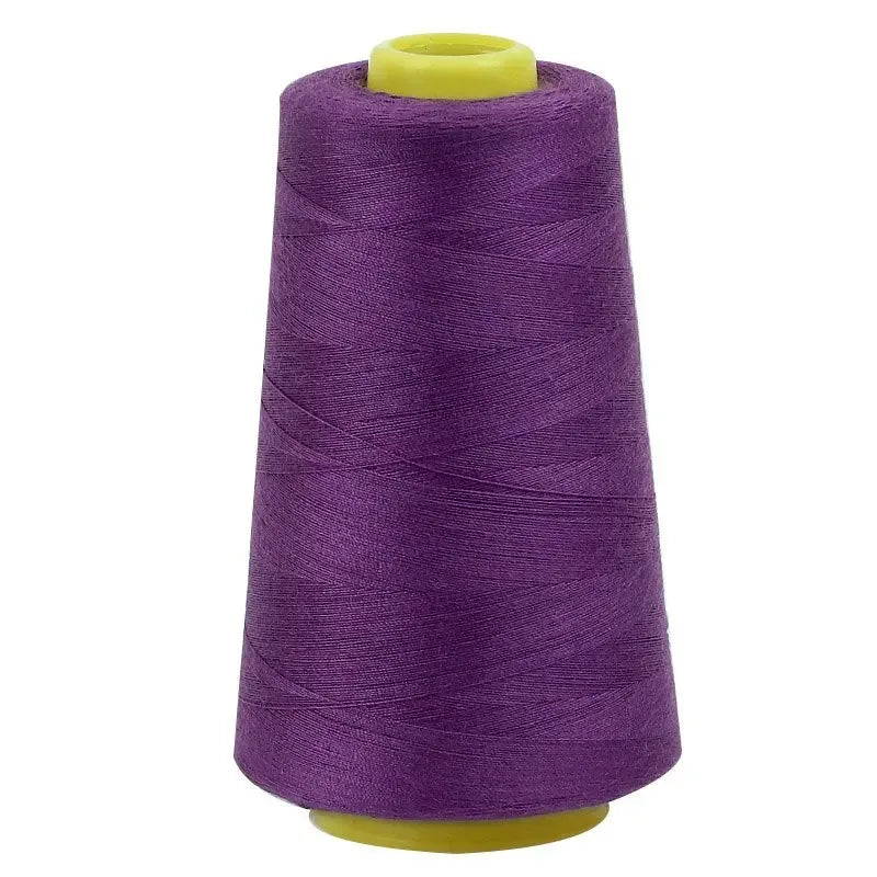A roll of purple premium sewing thread on a yellow spool.