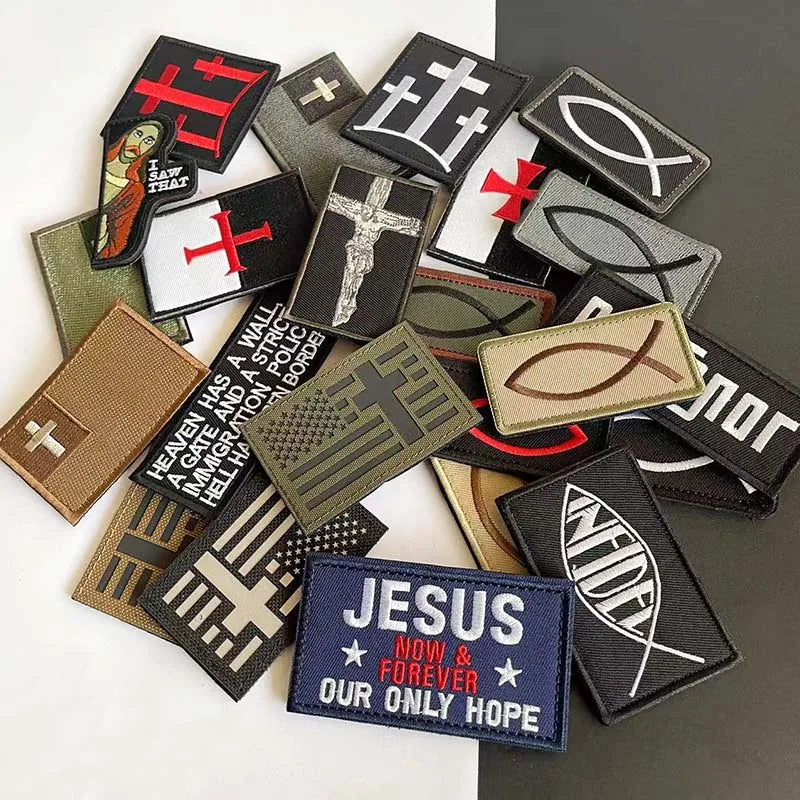 A collection of embroidered patches featuring Christian faith symbols like crosses and flag designs on various fabric colors.