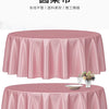 A pink satin round table cloth draped elegantly on a table, suitable for formal decoration.