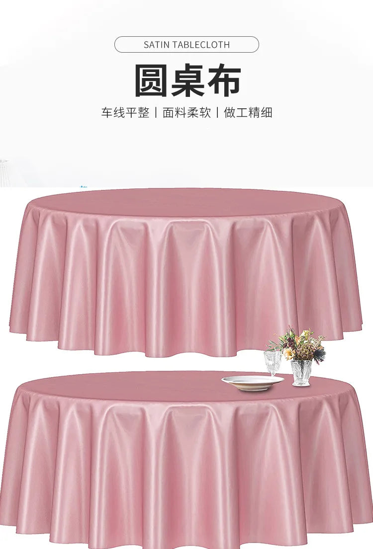 A pink satin round table cloth draped elegantly on a table, suitable for formal decoration.