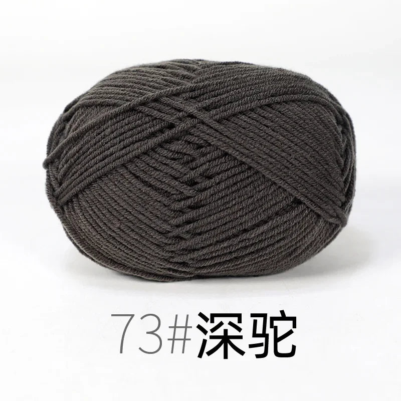 A ball of dark gray organic cotton 4ply knitting yarn for crafts.