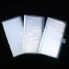 Three clear plastic photo storage cards displayed side by side against a black background.