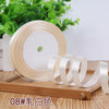Roll of satin ribbon in white color on a wooden board