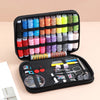 A black zippered case containing a complete sewing kit with numerous spools of colored thread and various tools for handicraf