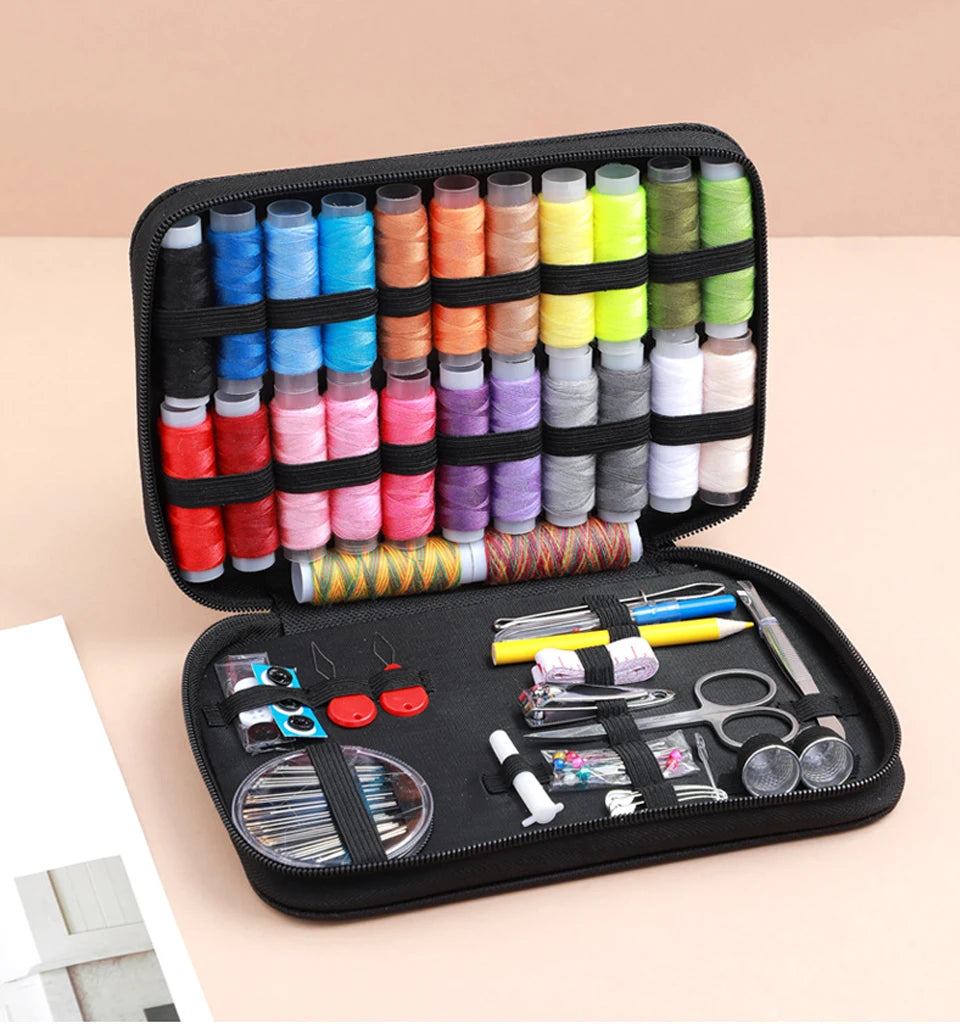 A black zippered case containing a complete sewing kit with numerous spools of colored thread and various tools for handicraf