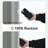Demonstration of solid blackout privacy curtains blocking light and showing a phone light turned on.