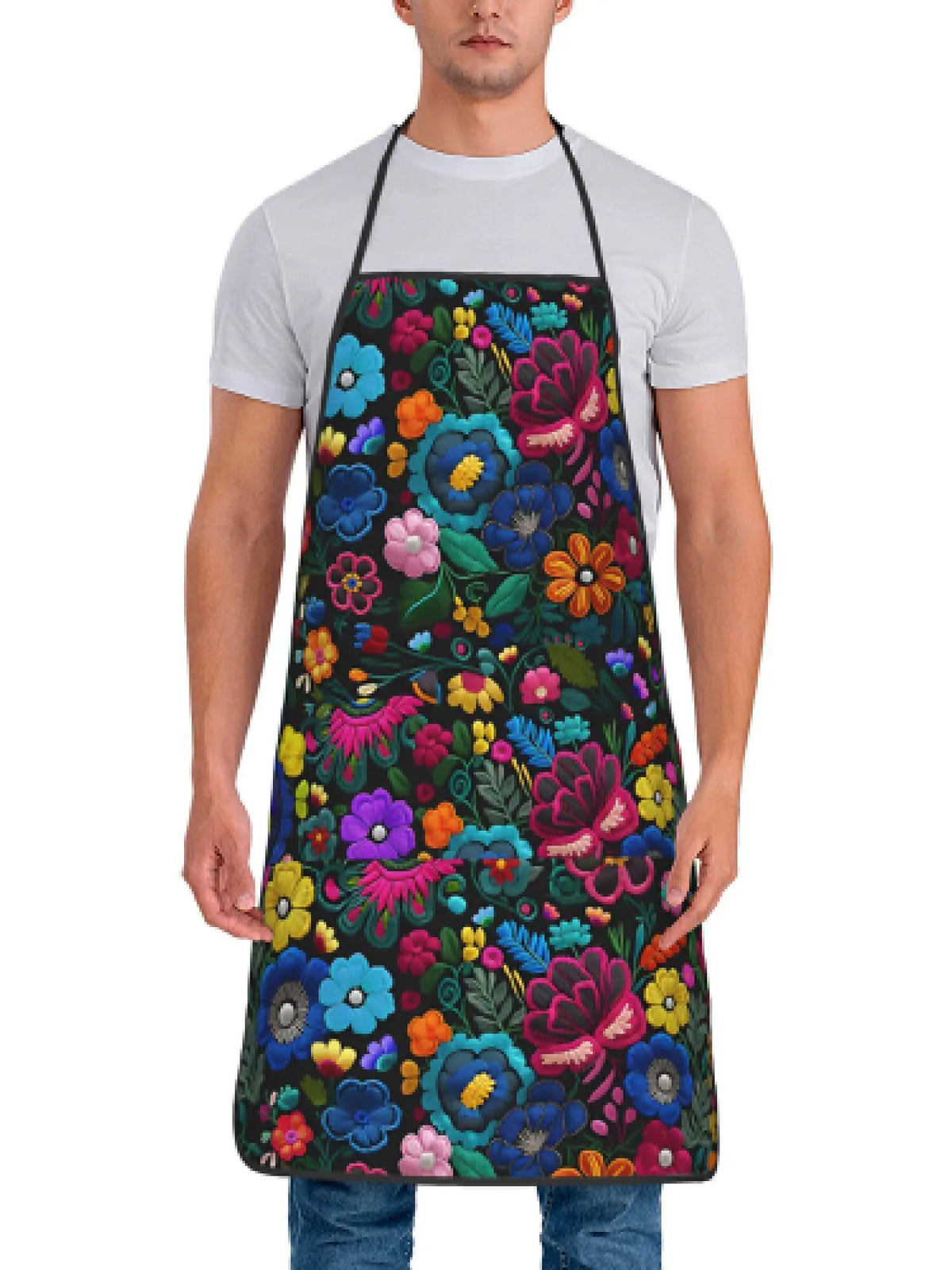A man wearing a floral tatting apron over a white t-shirt.