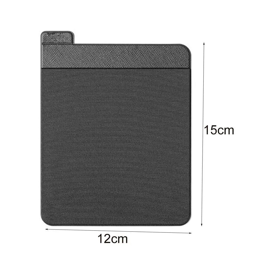 A black adhesive laptop back storage pouch with a textured surface and a flap closure.