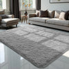 A plush gray bedroom carpet with a non-slip backing placed in a modern living room.